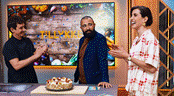 A group of people standing in front of a cake

AI-generated content may be incorrect.
