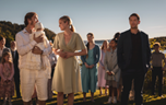 A group of people standing in a line

AI-generated content may be incorrect.