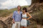 A person and person standing in a grassy area

AI-generated content may be incorrect.